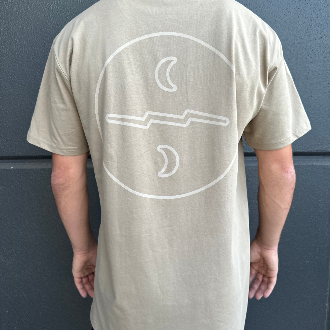 Sand colour relaxed fit t-shirt with white Missing At Sea logo on chest and large circle logo on the back