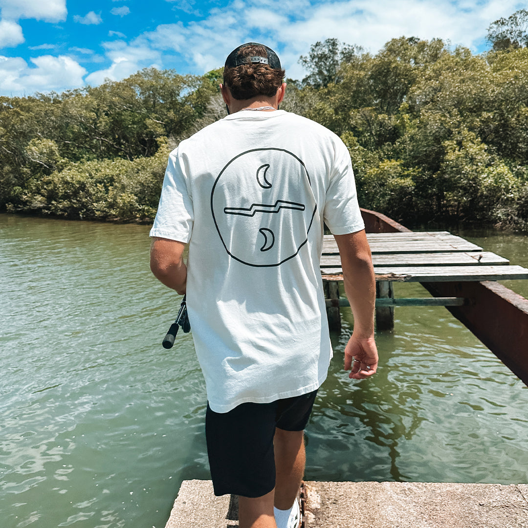 White relaxed fit t-shirt with black Missing At Sea logo on chest and large circle logo on the back